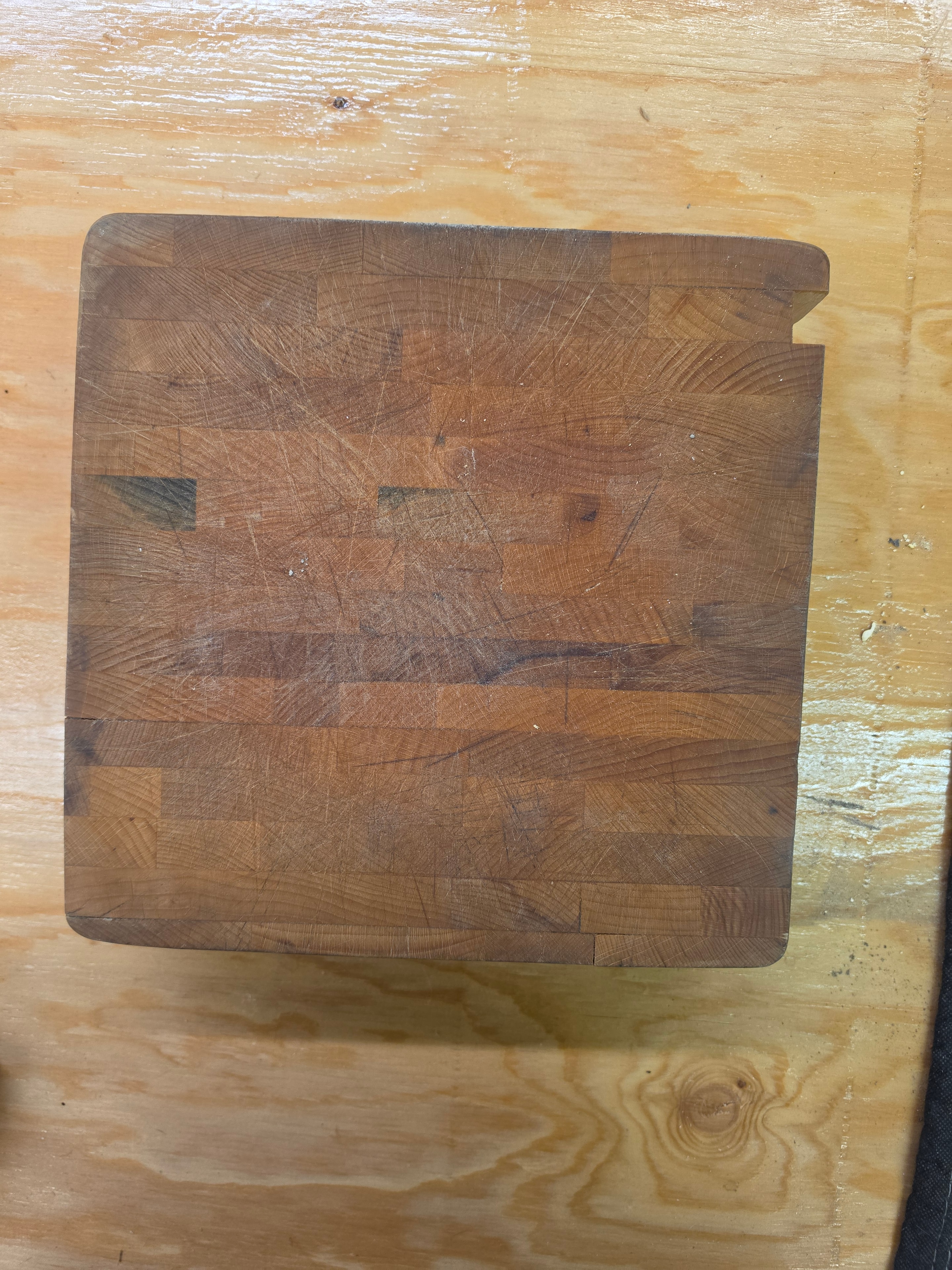 Cutting board before restoration — deep scratches and worn surface